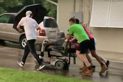 Kind Young Men Pushed Elderly Woman’s Electric Wheelchair To Her Care Home After It Broke Down In Rain